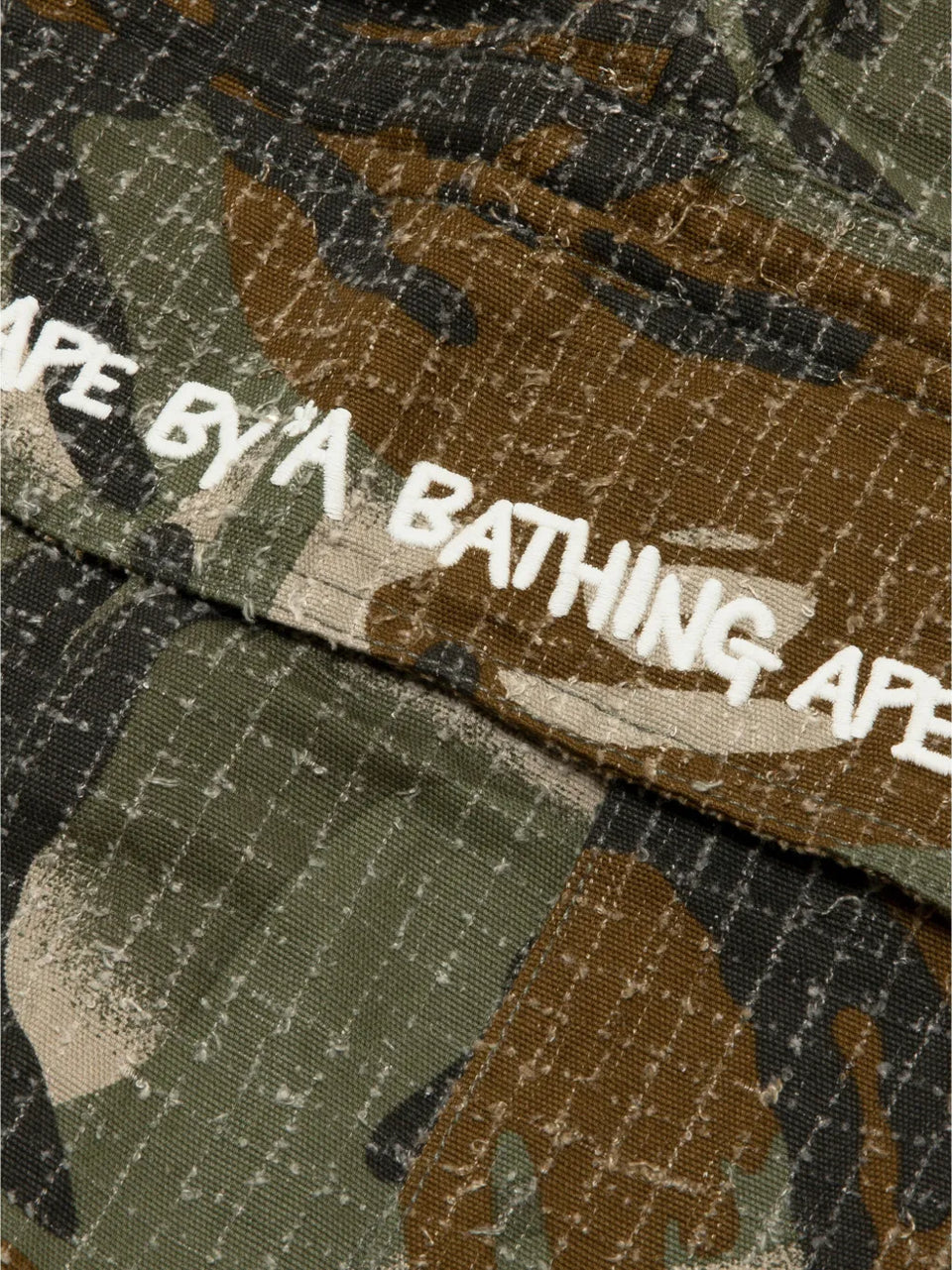 camouflage print trousers