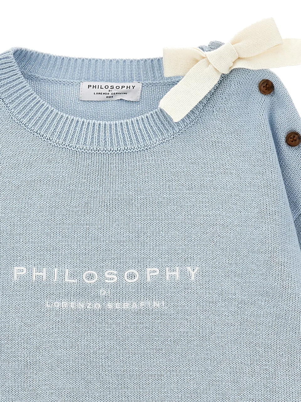 bow-buttoned sweater