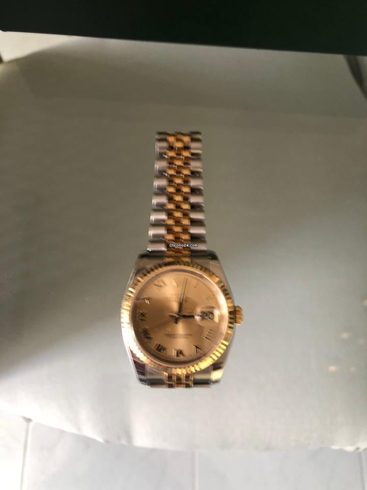 Rolex Oyster Perpetualyear 2009. Vintage. 18k gold. Stamps of authenticity.