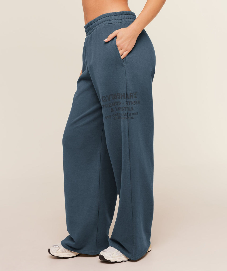 Women's Gymshark Stacked Graphic Wide Leg Joggers Stealth Blue