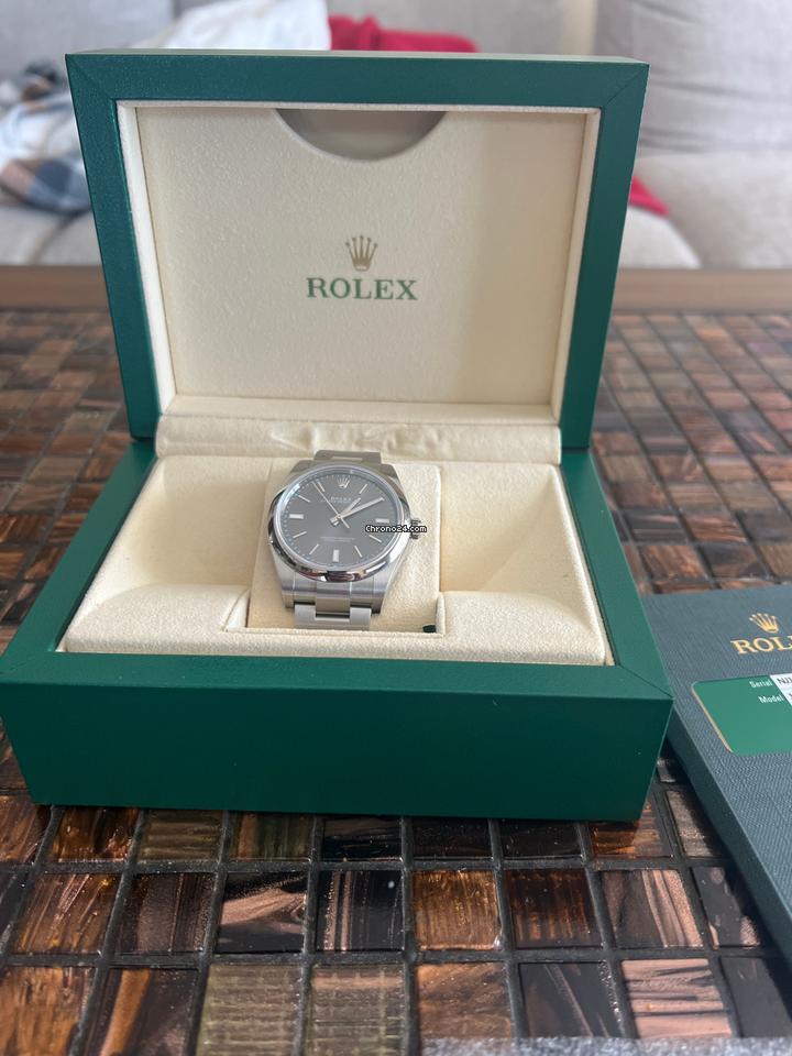 Rolex | Oyster Perpetual | 114300 | Steel | 39 mm | Steel | Red | Automatic