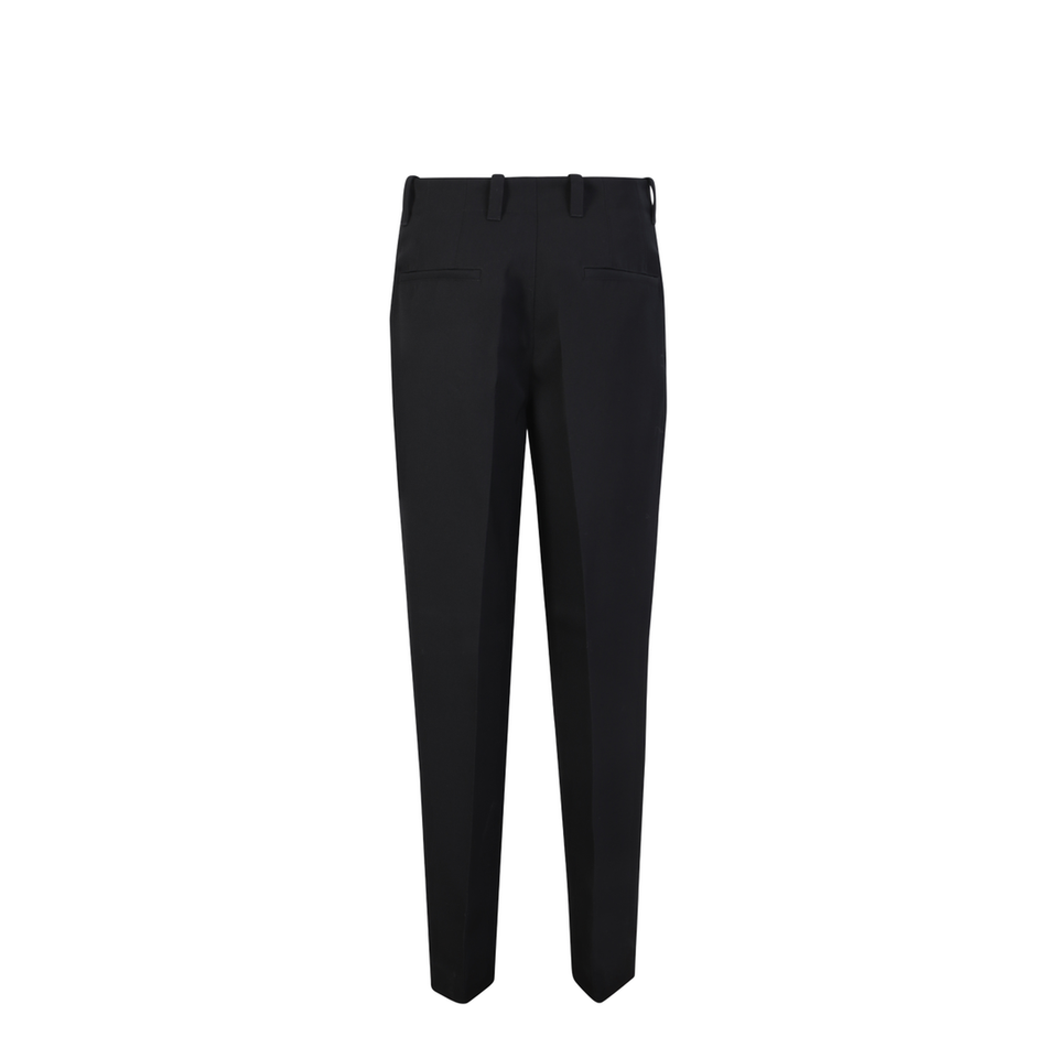 Adjustable drawstring waist. Tapered cut. Front zip closure. Side pockets