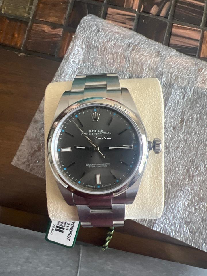Rolex | Oyster Perpetual | 114300 | Steel | 39 mm | Steel | Red | Automatic