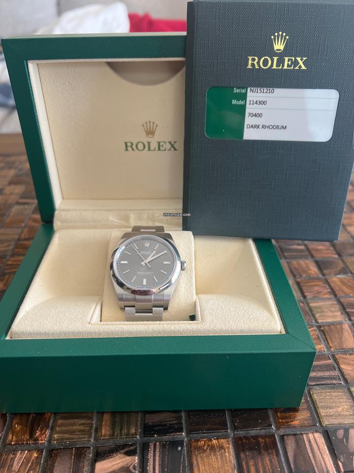 Rolex | Oyster Perpetual | 114300 | Steel | 39 mm | Steel | Red | Automatic